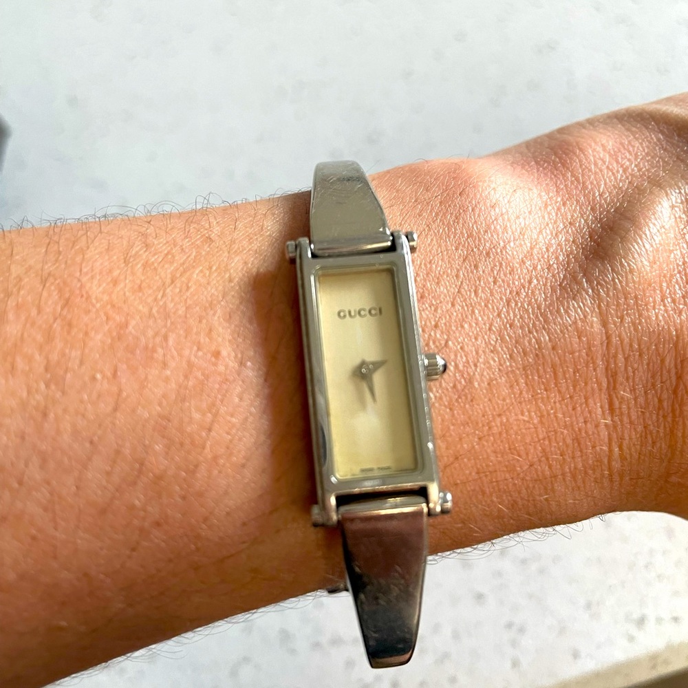 Women’s authentic stainless steel Gucci watch.